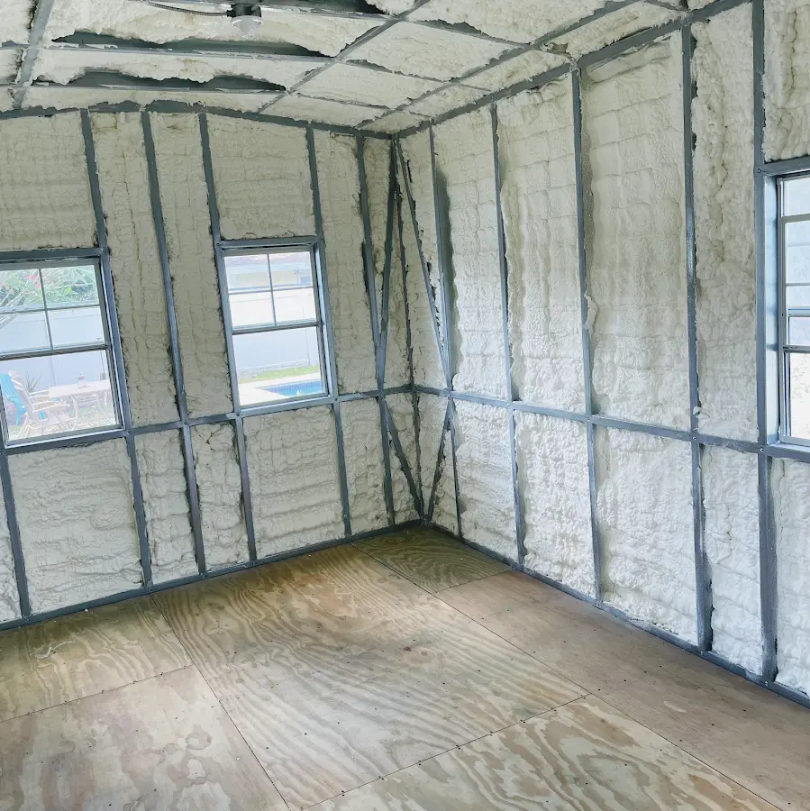 Closed-cell spray foam insulation applied to wall cavities in a residential project in Batavia